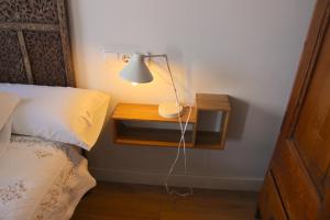 A bed or beds in a room at Mr. Serrano Apartments