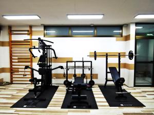 a gym with several tread machines in a room at Complejo Turístico Los Escullos San Jose in Los Escullos