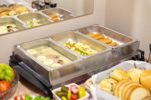 a bunch of trays of food in a refrigerator at RR pokoje in Kielce