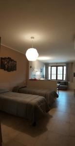 Postel nebo postele na pokoji v ubytování B&B GIRAMONDO