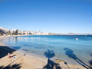 a view of a beach with a city in the background at Apartment Voramar-5 by Interhome in Calpe