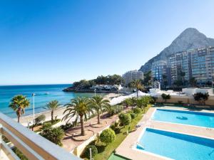 a view of the ocean from the balcony of a resort at Apartment Voramar-5 by Interhome in Calpe