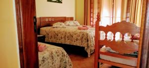 Cama ou camas em um quarto em Sítio Flora Rei