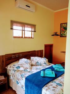 Cama ou camas em um quarto em Sítio Flora Rei