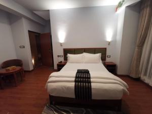 Katil atau katil-katil dalam bilik di Ludrong Hotel
