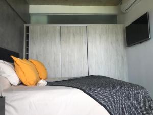 
Una cama o camas en una habitación de Puerto del Aguila Premium Apart
