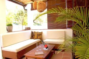a living room with a couch and a table at Valle de Oro in Villanueva de Algaidas