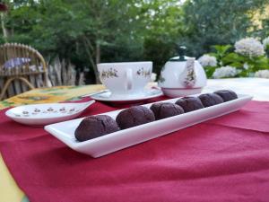 a plate of chocolate cookies on a table at Locanda SottoBosco in San Leonardo