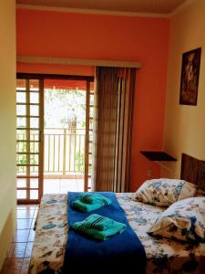 Cama ou camas em um quarto em Sítio Flora Rei