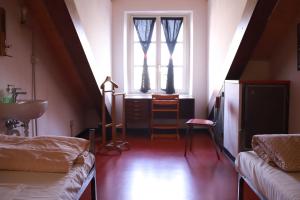 Postel nebo postele na pokoji v ubytování Attic Hostel Torino