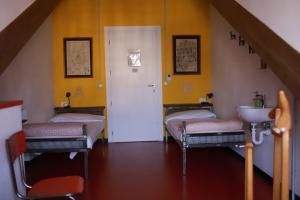 Postel nebo postele na pokoji v ubytování Attic Hostel Torino