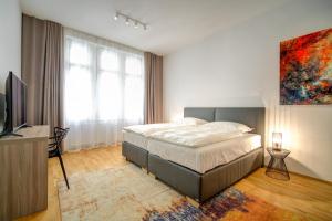 Postel nebo postele na pokoji v ubytování Bishop Apartments