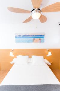 a bedroom with a ceiling fan and a bed at Flamingo Friendly Holiday Home in Playa del Ingles