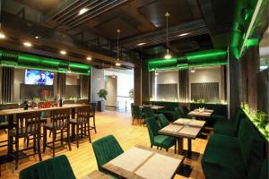 TV a/nebo společenská místnost v ubytování Hotel Olive