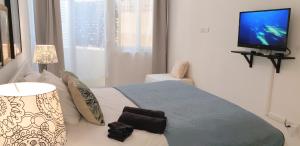 Postel nebo postele na pokoji v ubytování R1101ERI by euroresort