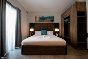 Postel nebo postele na pokoji v ubytování Pebbles Resort