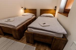 Кровать или кровати в номере Horský apartmán Václavov