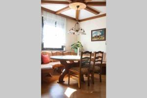 a dining room with a table and chairs at Ferienwohnung Fischl in Rust