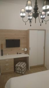 Ένα ή περισσότερα κρεβάτια σε δωμάτιο στο App Centar