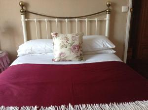 Ein Bett oder Betten in einem Zimmer der Unterkunft Hyacinth Bed & Breakfast