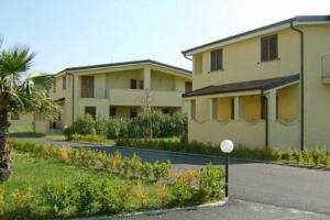 a building with a street in front of it at Caulonia, 2 bed 1st Floor Apartment Close To Beach in Caulonia Marina