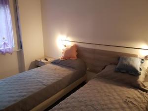 Postel nebo postele na pokoji v ubytování B&B Confine
