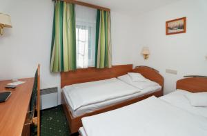 Posteľ alebo postele v izbe v ubytovaní Hotel Spindlerova Bouda