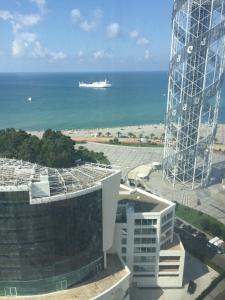 a view of the ocean and a cruise ship at batumi porta tower 1811 in Batumi