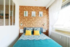 Katil atau katil-katil dalam bilik di Appart'Confort - Le Natura