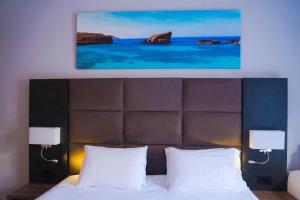 Postel nebo postele na pokoji v ubytování Pebbles Resort