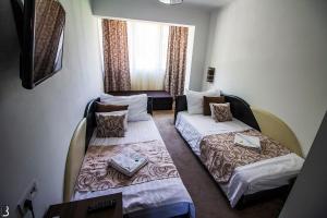 Postel nebo postele na pokoji v ubytování Hotel Írisz