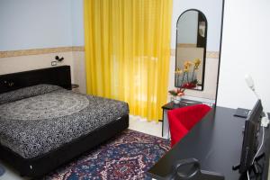 Postel nebo postele na pokoji v ubytování Hotel Letizia