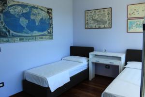 מיטה או מיטות בחדר ב-Casa Plancia