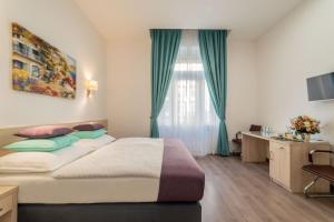 Posteľ alebo postele v izbe v ubytovaní Global Suites Budapest