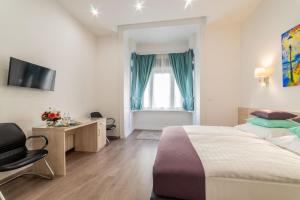 Posteľ alebo postele v izbe v ubytovaní Global Suites Budapest