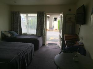 Postel nebo postele na pokoji v ubytování Bentons Motel
