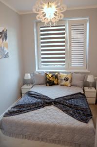 Кровать или кровати в номере Apartament DeLuxe 1