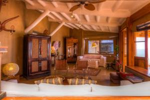 a living room with a couch and a table at Casa Adobe in Vichayito