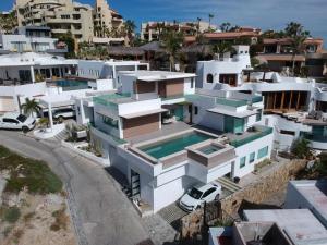 an aerial view of a house with a swimming pool at Departamento MarAzul in Cabo San Lucas