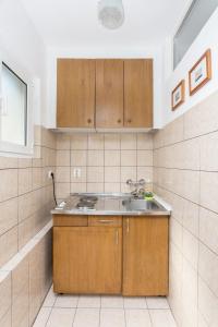 Кухня или мини-кухня в Lussino Accommodation
