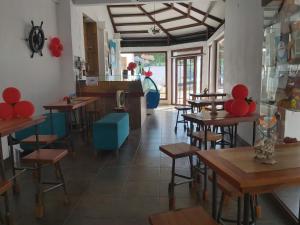 Reštaurácia alebo iné gastronomické zariadenie v ubytovaní Hostal Gualingo
