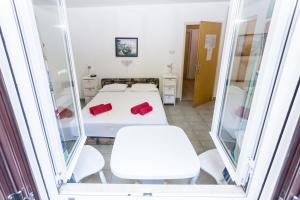 Katil atau katil-katil dalam bilik di Lussino Accommodation