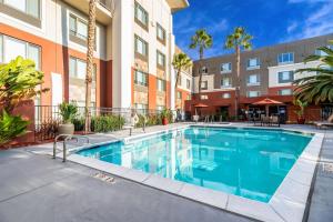 an image of a swimming pool in a apartment building at Holiday Inn Express Fremont - Milpitas Central by IHG in Fremont