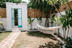 a hammock in the backyard of a house at Bamboo Bungalows in Nusa Lembongan