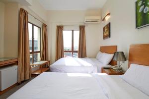 Postel nebo postele na pokoji v ubytování Kepong Hotel + 37 fotografií