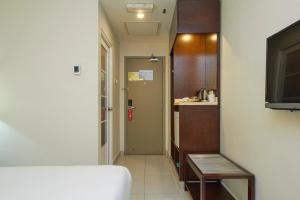 TV a/nebo společenská místnost v ubytování Kepong Hotel