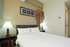 Postel nebo postele na pokoji v ubytování Kepong Hotel