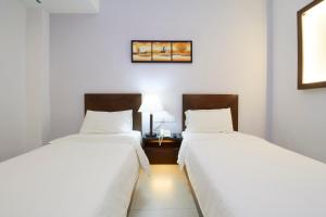 Postel nebo postele na pokoji v ubytování Kepong Hotel