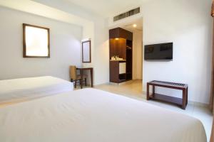 Postel nebo postele na pokoji v ubytování Kepong Hotel