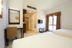 Postel nebo postele na pokoji v ubytování Kepong Hotel